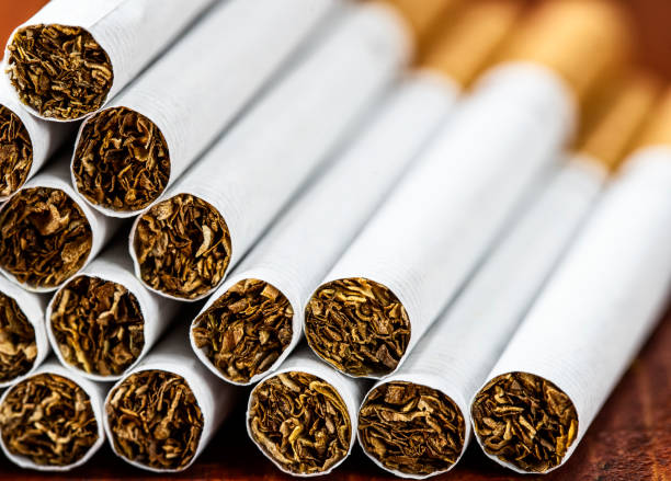 Close up of a smoking cigarettes. Tobacco product.